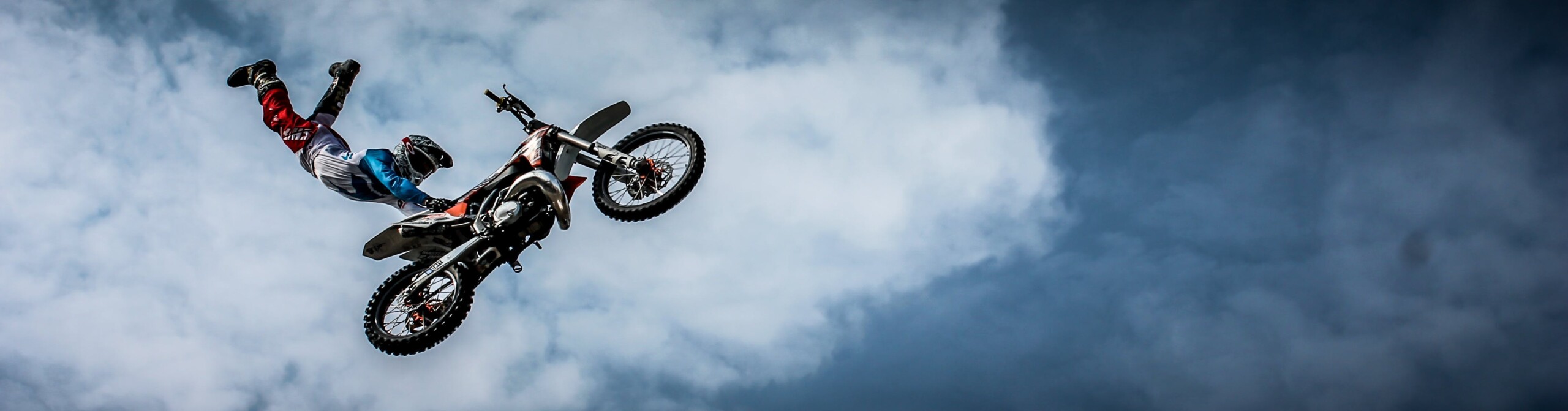 Motorbike and rider flying through the air doing a trick