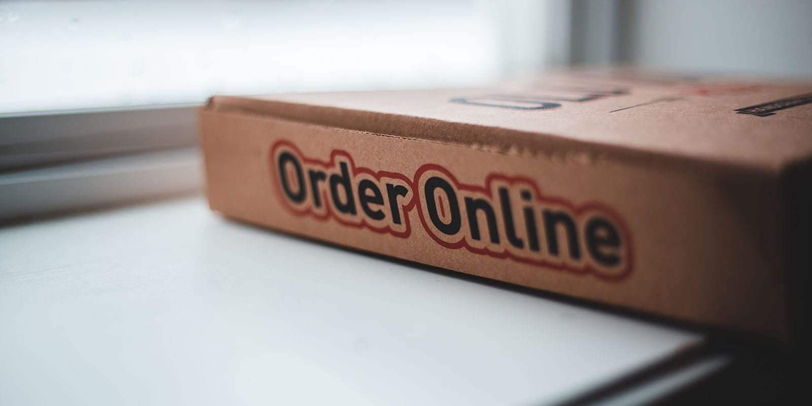 Side of Pizza Box that says "Order Online"