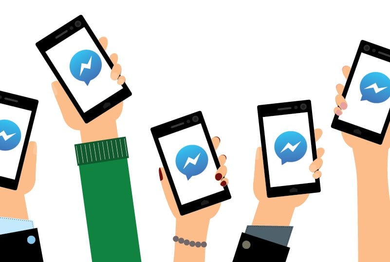 Illustrated hands holding up smart phones with Facebook Messenger logo on each one.