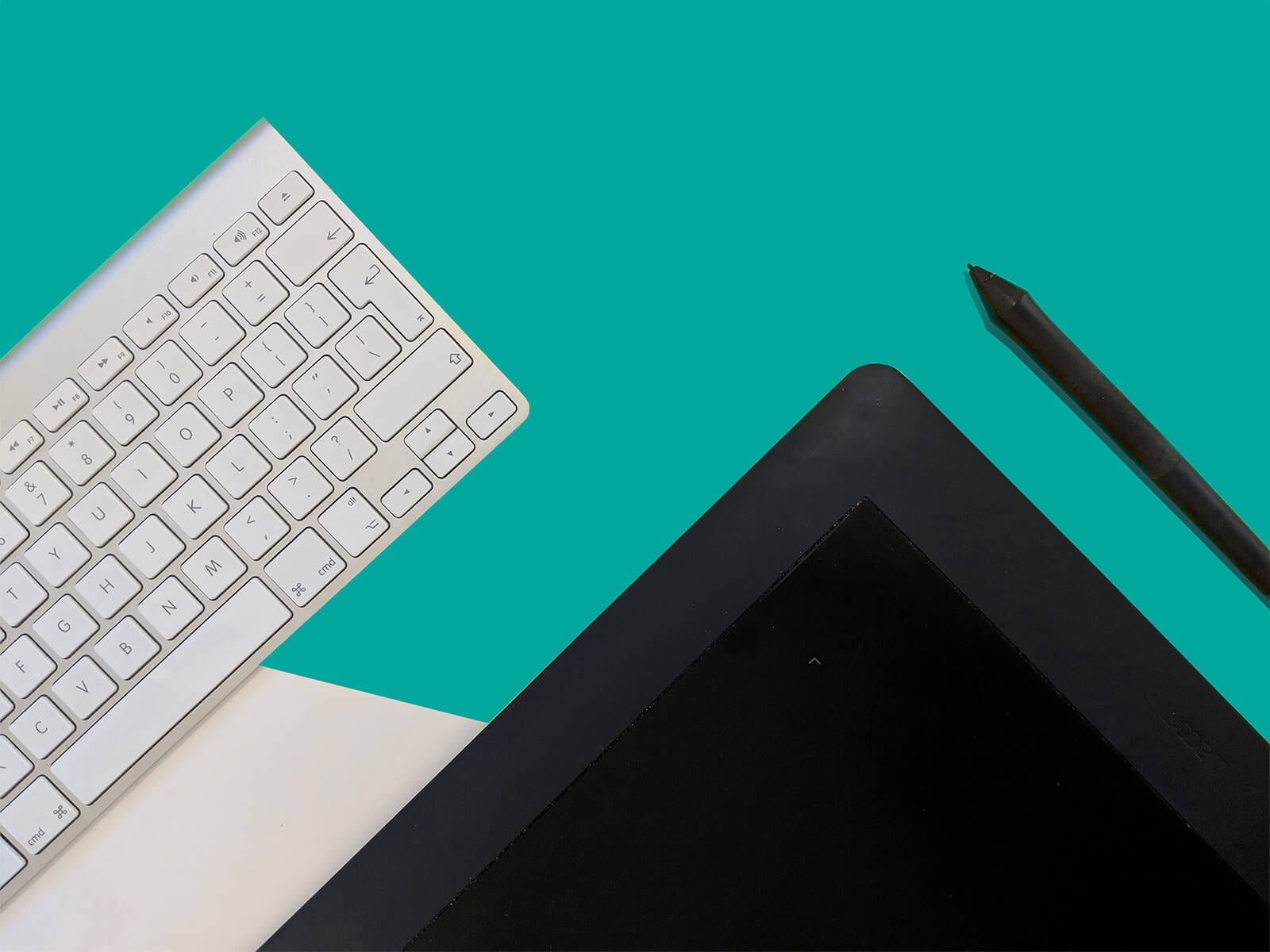 Teal background with keyboard, monitor and touchscreen pen
