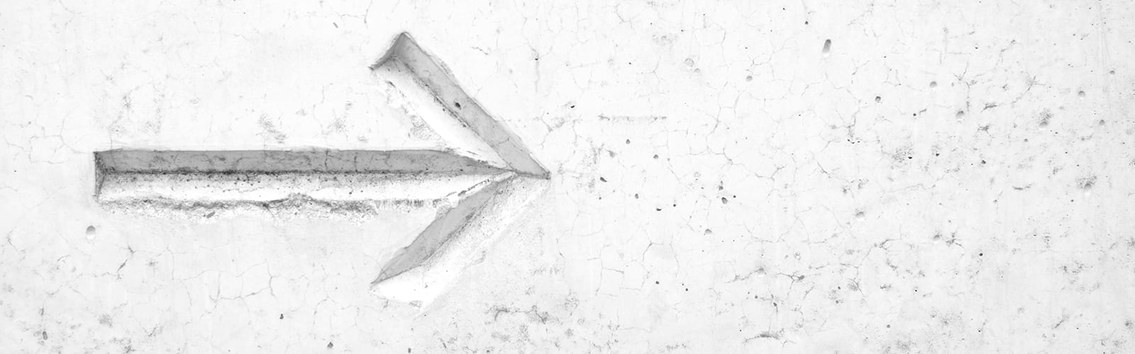 arrow embossed in white stone