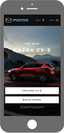 Mazda website on mobile phone with a red car on screen