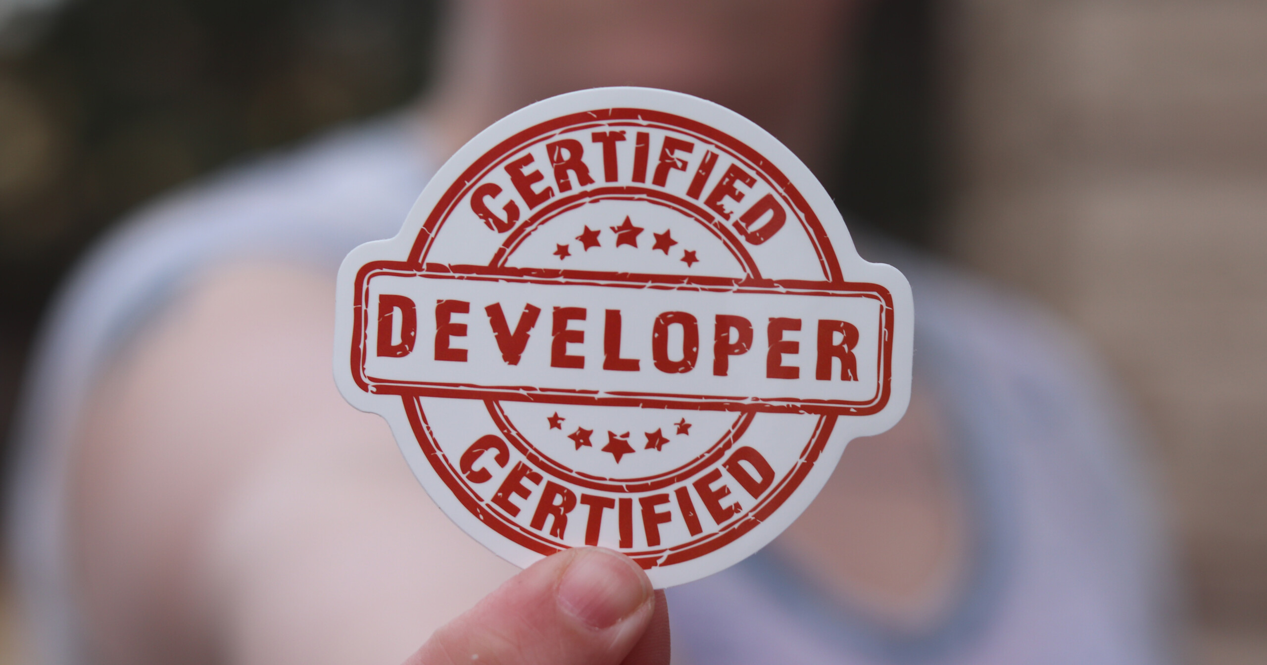 Person holding sign for Certified Developer