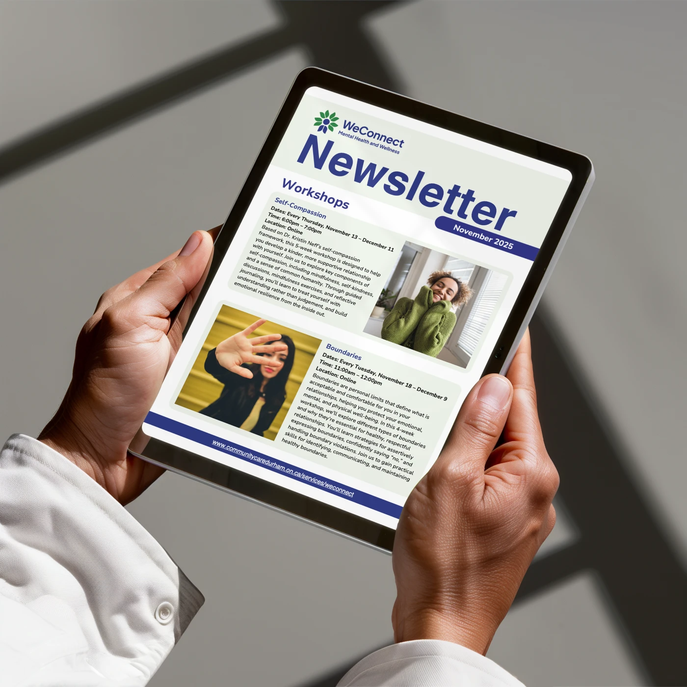 Male hands holding an iPad with a digital e-newsletter on the screen